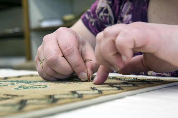 Stitch-mounting a sampler prior to framing